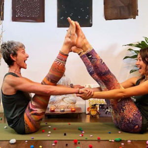 beth borowsky and yoga partner in boat pose