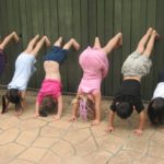 pre-schoolers upside down for fun yoga activites