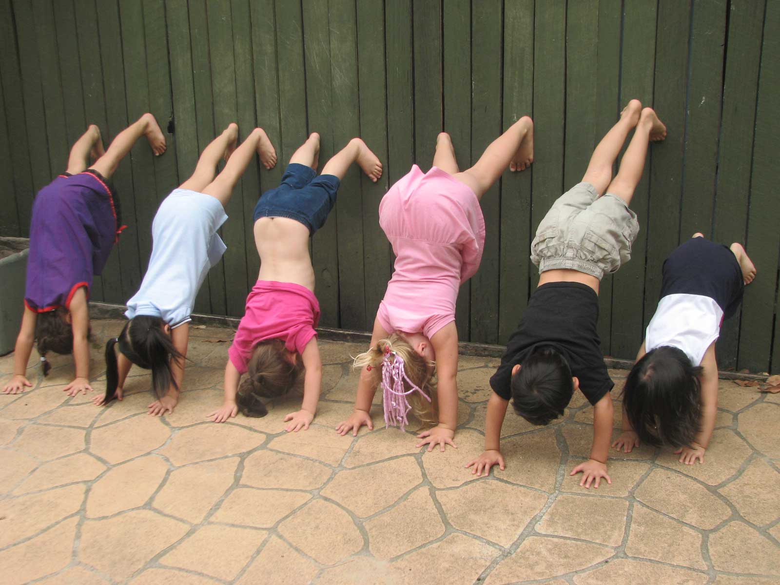 pre-schoolers upside down for fun yoga activites