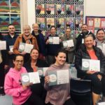 group of teachers holiday certificates after completing yoga course for NESA
